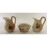 ROYAL WORCESTER: A pair of gilded ewers together w