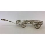 An unusual silver plated decanter wagon with pierc