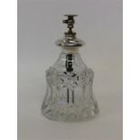 A tall cut glass scent atomiser marked Sterling. E