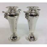 A pair of large tapering spill vases with gargoyle