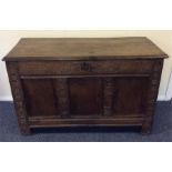A good oak carved three panel coffer with hinged t