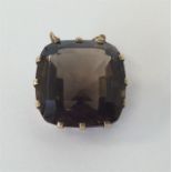 A large smoky quartz pendant in gold frame. Approx