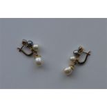 A good pair of diamond and pearl four stone drop e