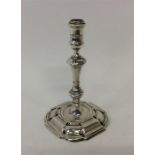 A Georgian taper candlestick with cut corners and