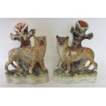 A pair of early Staffordshire figures of leopards.
