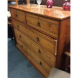 A massive pine five drawer chest on plinth base. E