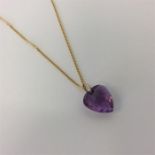 An amethyst heart shaped pendant on 18 carat fine