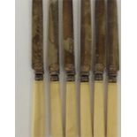 A set of six Continental silver gilt knives with t