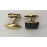 A pair of Russian hard stone silver gilt cufflinks