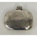 A small Victorian hip flask with engraved decorati