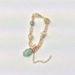 An Art Nouveau gold, turquoise and pearl bracelet