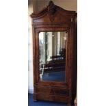 A French kingswood armoire with mirrored plate and