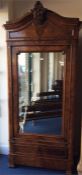 A French kingswood armoire with mirrored plate and