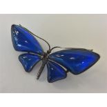 A silver butterfly wing brooch in the form of a bu