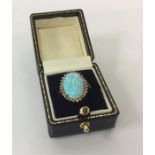 An opal and diamond oval cluster ring in gold claw