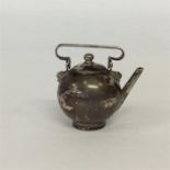 A miniature kettle with lift-off cover. Approx. 25