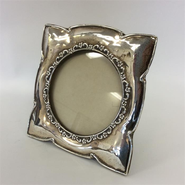 A square picture frame with circular aperture to l