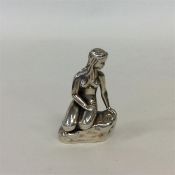 An unusual small desk paperweight in the form of "