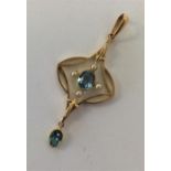 An attractive 15 carat aquamarine and pearl drop p