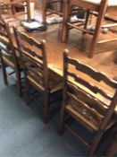 A massive oak refectory table with stretcher base