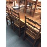 A massive oak refectory table with stretcher base