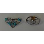 CHARLES HORNER: Two silver brooches inset with gem