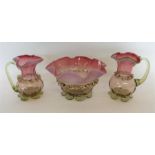A good pair of cranberry glass ewers together with