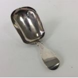 A Georgian fiddle pattern caddy spoon. London. By