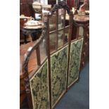 A mahogany scroll decorated three fold screen. Est