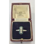 A diamond and emerald triple ring of Art Deco form