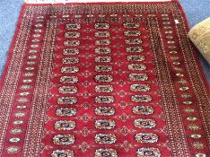 An Oriental tapestry rug. Est. £50 - £80.