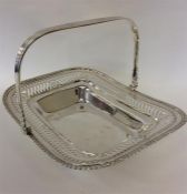 A silver swing handled basket with reeded decorati