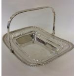 A silver swing handled basket with reeded decorati