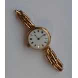A lady's 9 carat wristwatch on gold expanding stra