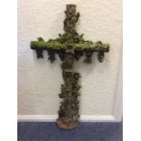 A large cast figure of a crucifix decorated with s