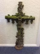 A large cast figure of a crucifix decorated with s