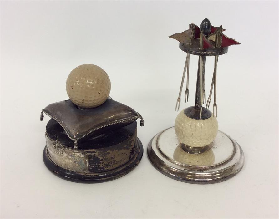 OF GOLFING INTEREST: Two novelty golfing trophies,