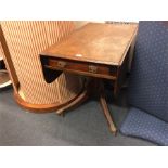 A good mahogany breakfast table on brass castors.