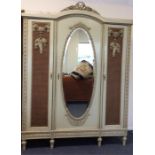 A good French painted triple wardrobe with mirrore