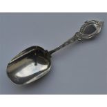 An unusual bright cut caddy scoop with engraved de