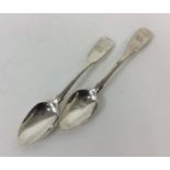 A pair of Canadian fiddle pattern dessert spoons.