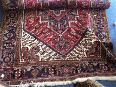 A large tapestry carpet. Est. £100 - £150.