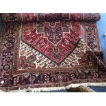 A large tapestry carpet. Est. £100 - £150.