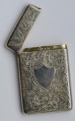 An attractively engraved card case with hinged top