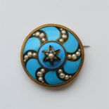 A massive circular enamelled target brooch with ro