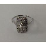 A high carat plaque ring with pierced decoration o