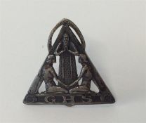 An Art Nouveau badge in the form of two praying wo
