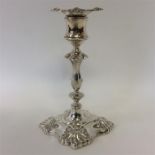 A good silver candlestick with shell decoration an