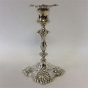 A good silver candlestick with shell decoration an