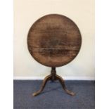 A Georgian mahogany pedestal table with ring suppo